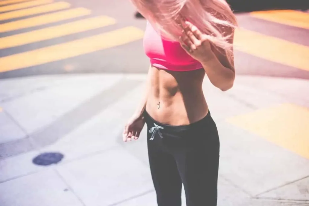 Woman with toned stomach after LA-EMS Body Sculpting Treatment Dormer's Wells